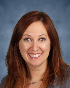 Photo of woman with reddish hair, smiling