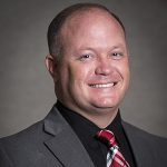 Smiling Man with plaid tie