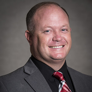 Smiling Man with plaid tie