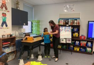 Teacher and student using a tablet