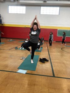 Student demonstrating a yoga pose.