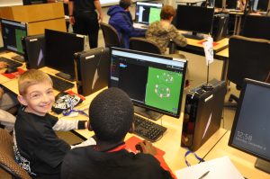 two students working at a computer