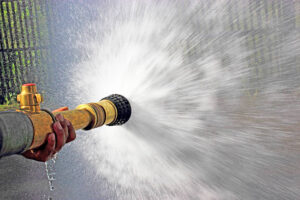 photo of a firehose blasting water