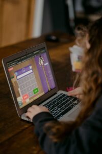 image of student coding on a computer